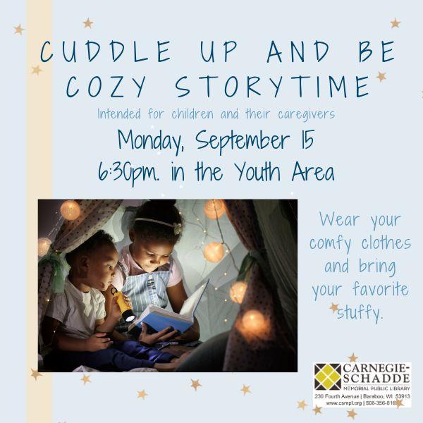 Children reading a book together under warm lighting